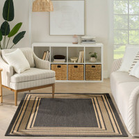 charcoal geometric indoor outdoor rug in a room