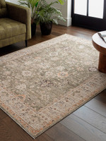 green traditional rug in a living room with matching decor