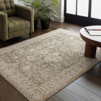 green traditional rug in a living room with matching decor