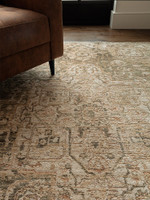 green traditional rug in a living room with matching decor