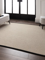 cream wool jute rug in a living room with matching decor