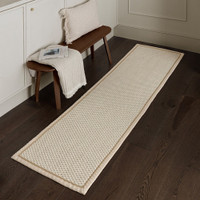 cream wool jute rug in a living room with matching decor