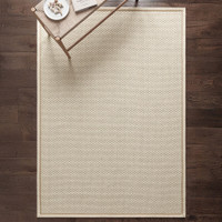cream wool jute rug in a living room with matching decor