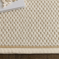 cream wool jute rug  edge on wood floor