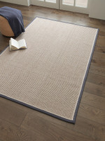 cream wool jute rug in a living room with matching decor