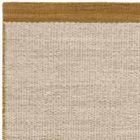 gold flatweave wool rug closeup corner