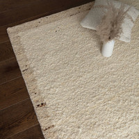 beige wool rug rug in a living room with matching dec