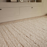beige wool rug rug in a living room with matching dec