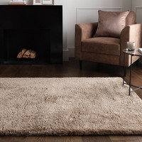 taupe shaggy rug in a living room with matching decor