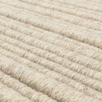 Detailed texture shot of woven natural wool fibers in a neutral off-white horizontal rib pattern.