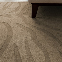 Detailed angle of a high-pile brown and black animal print wool rug highlighting its thick luxurious weave.