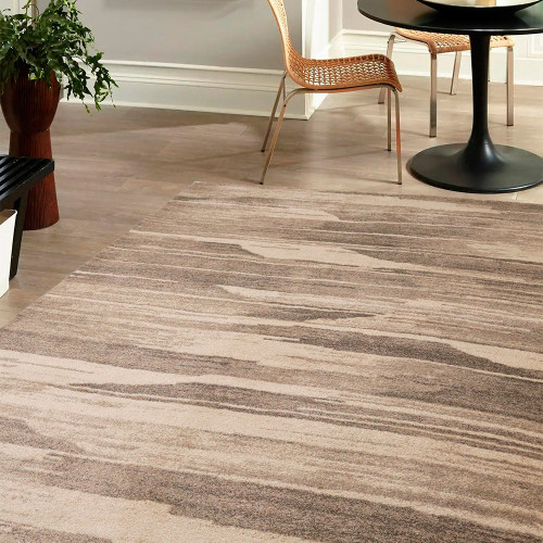 Freya Abstract Natural Rug in a living room