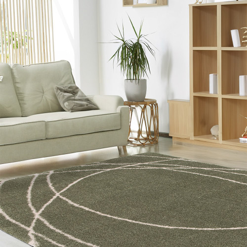 Halo Squiggle Sage Green Rug in a living room