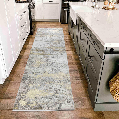 gold and grey abstract rug runner in a kitchen