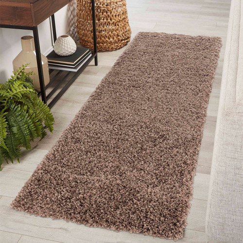 plain shaggy dark beige rug runner in a hallway