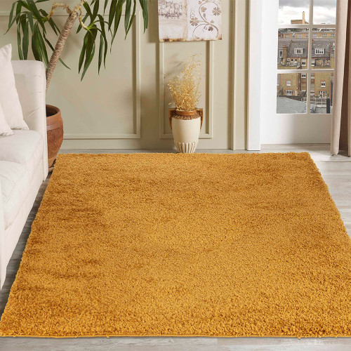 plain shaggy gold rug in a living room