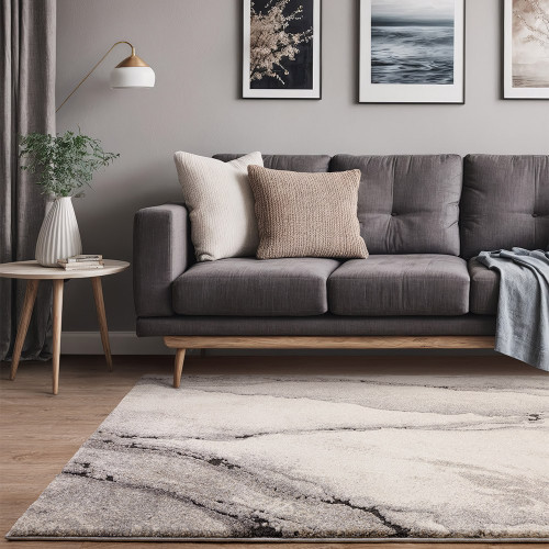 abstract grey shaggy rug in a living room with grey sofa