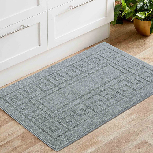 greek key dark grey doormat in a living room