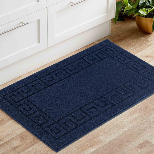 greek key navy doormat in a living room