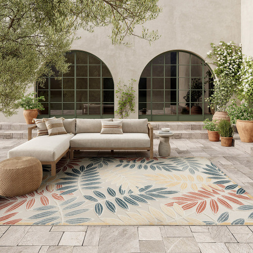 floral ivory blue rug outdoors with furniture and plants