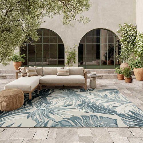 floral ivory blue rug outdoors with furniture and plants