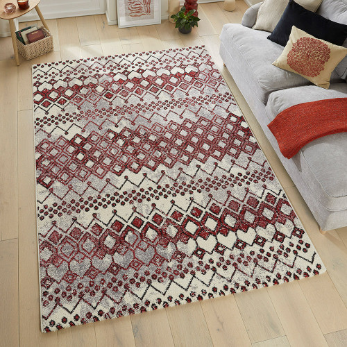 terracotta geometric rug in a living room with matching decor