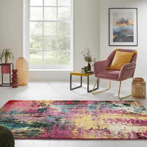 multicolour abstract rug in a living room with matching decor