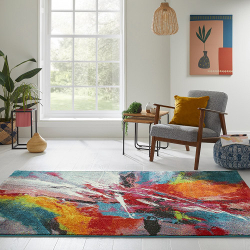 multicolour abstract rug in a living room with matching decor