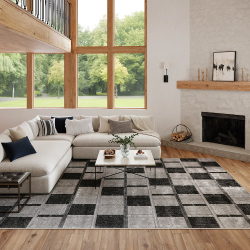 grey black geometric rug in a living room