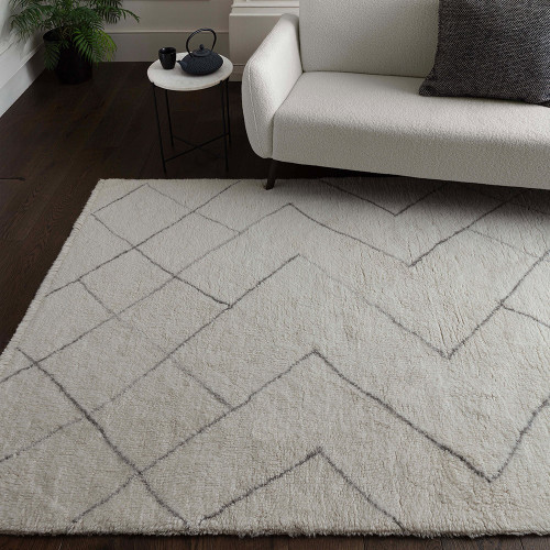 cream berber shaggy wool rug in a living room with matching decor