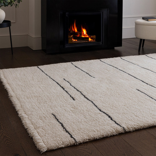 cream berber shaggy wool rug in a living room with matching decor