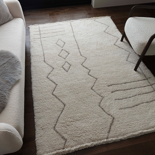 cream berber shaggy wool rug in a living room with matching decor