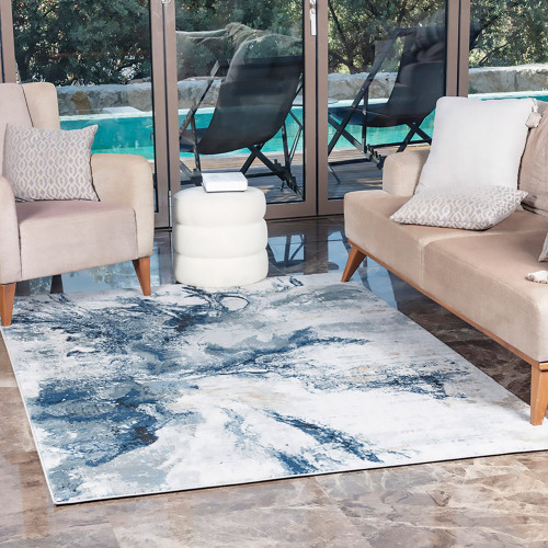 blue abstract rug in a room with matching decor