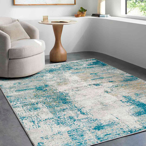 teal abstract rug in a room with matching decor
