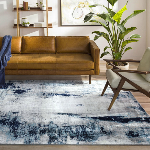 navy abstract rug in a room with matching decor