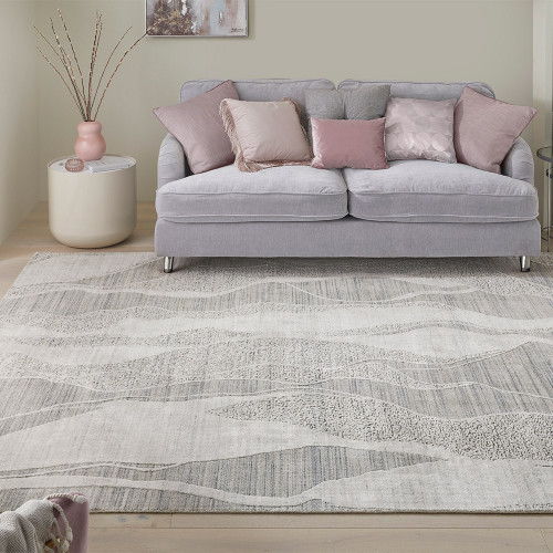 white blue abstract rug in a living room with matching decor