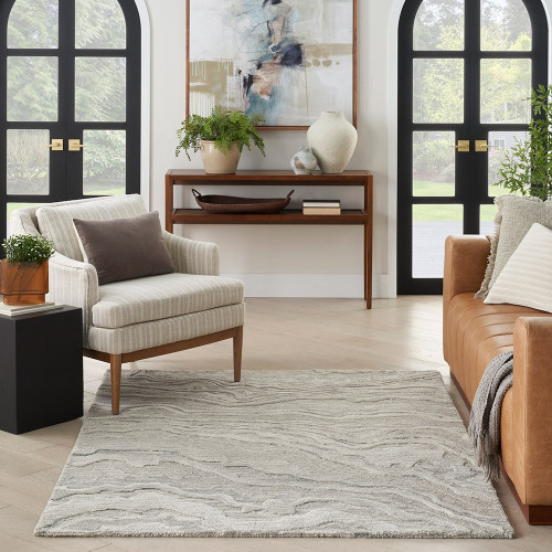 grey abstract rug in a room with matching decor