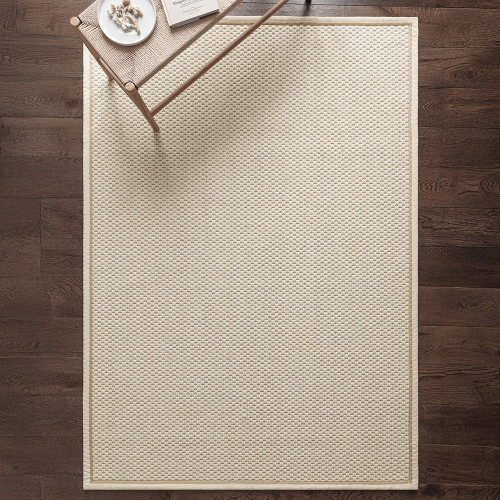 cream wool jute rug in a living room with matching decor