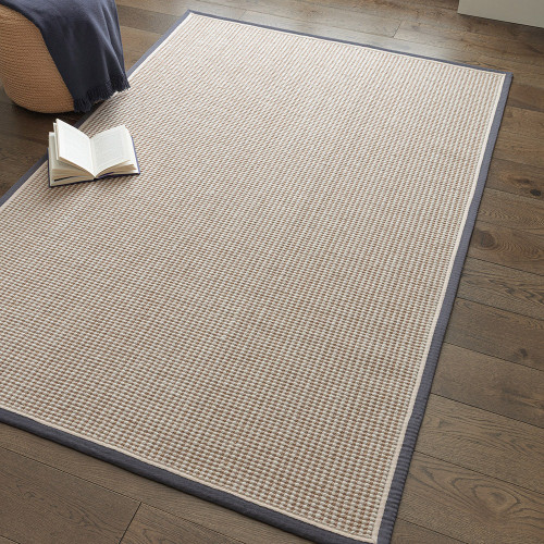 cream wool jute rug in a living room with matching decor