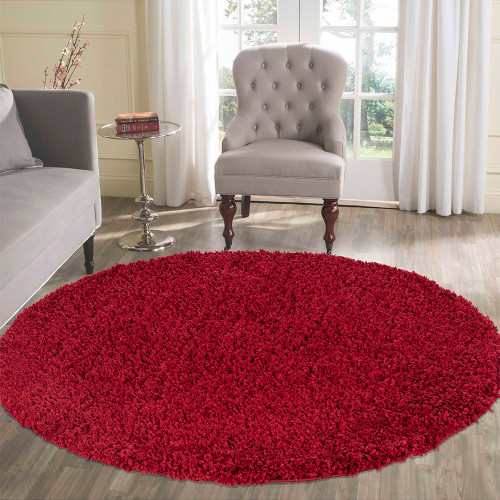 plain shaggy red circle rug in a living room