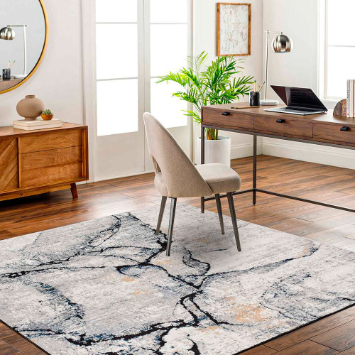 blue abstract rug in a room with matching decor