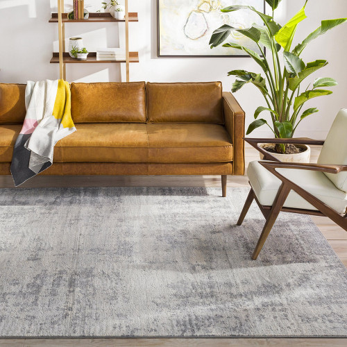 grey abstract rug in a room with matching decor