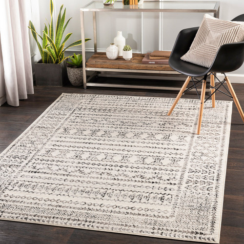 grey geometric rug in a room with matching decor