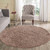 plain shaggy dark beige circle rug in a living room