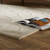 beige wool rug closeup with open book