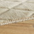 beige wool rug closeup edge