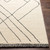 cream wool rug closeup corner on wood floor