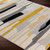 multicolour abstract rug in a room with matching decor