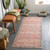 orange traditional rug in a room with matching decor