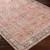 orange traditional rug closeup corner on wood floor